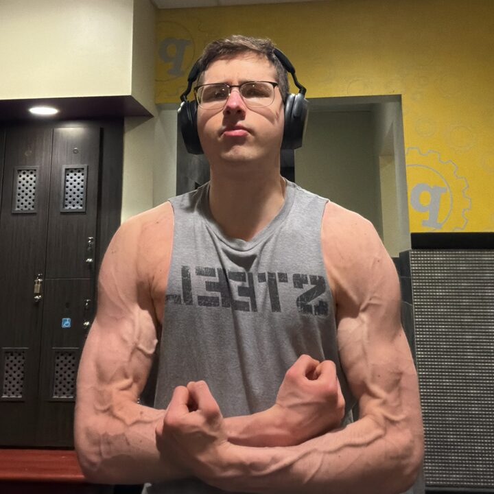 CoachP flexing at the gym